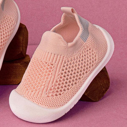 Pink breathable baby shoes designed for first walkers
